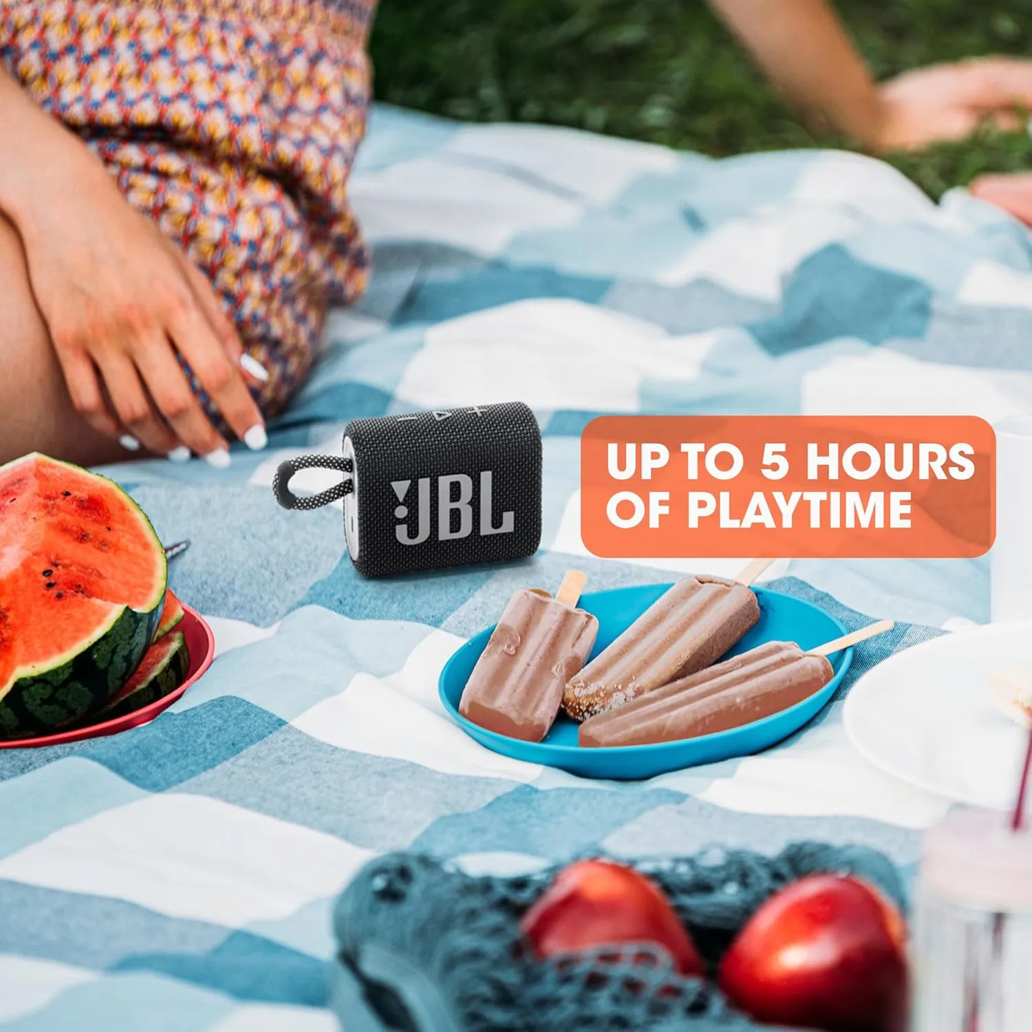 JBL Go 3 speaker with up to 5 hours of playtime on picnic blanket