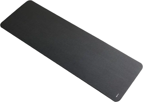 Person doing a floor workout on a black exercise yoga mat in a bright room.